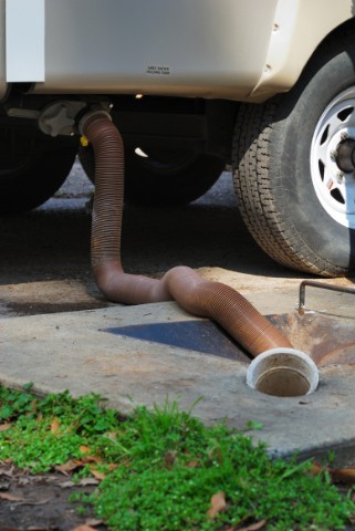 RV sewage dumping station in use