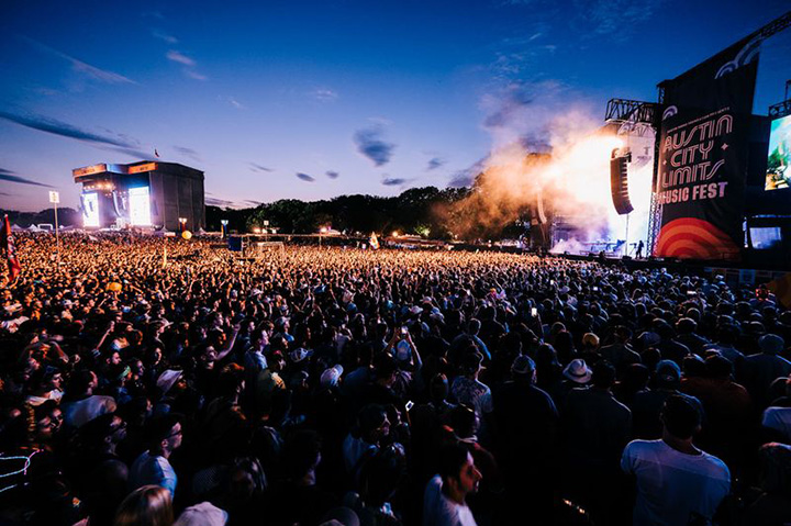 Massive crowd enjoying a live performance at the Austin City Limits Music Festival under the evening sky