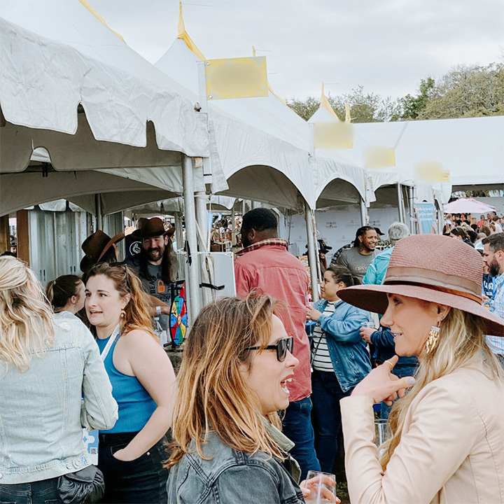 Festival-goers savoring drinks and local flavors at the Fredericksburg Food and Wine Fest