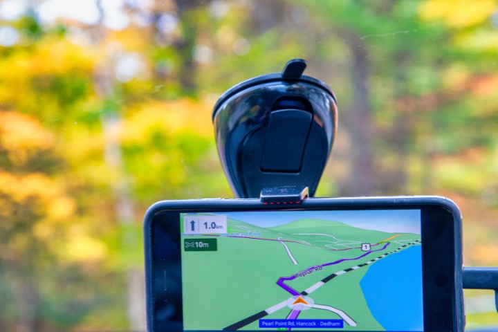 GPS device displaying directions on a scenic road during an RV trip