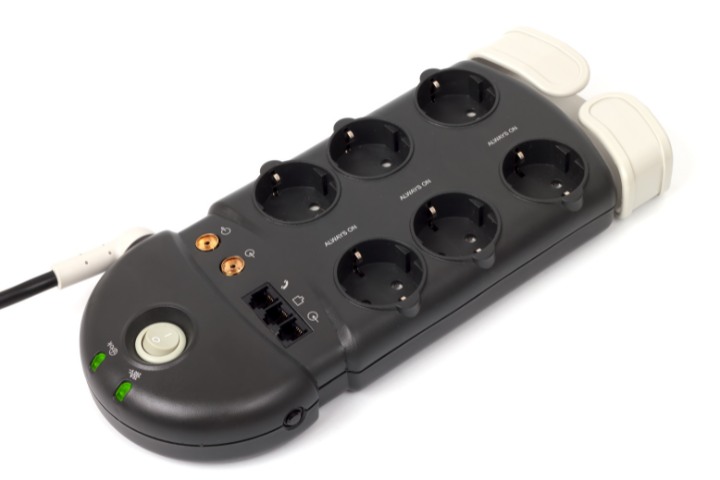 Portable power surge protector with multiple sockets for device protection