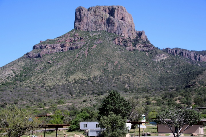 Scenic view of a towering mountain at Big Bend National Park, with an RV campground nestled below