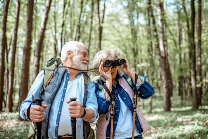 Senior couple birdwatching on a hiking trail near Fredericksburg RV park