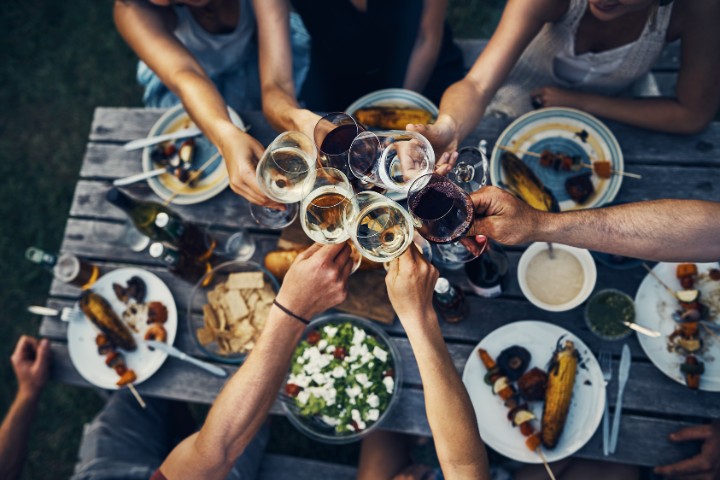Group toasting wine glasses at Fredericksburg Food and Wine Festival