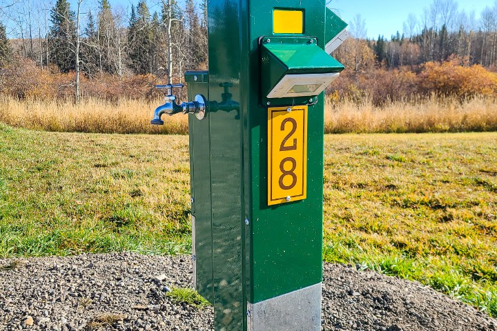 RV park utility pedestal with water faucet and electric hookup