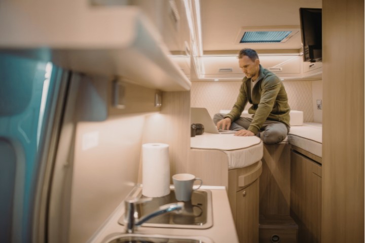 RV resident reviewing monthly living costs