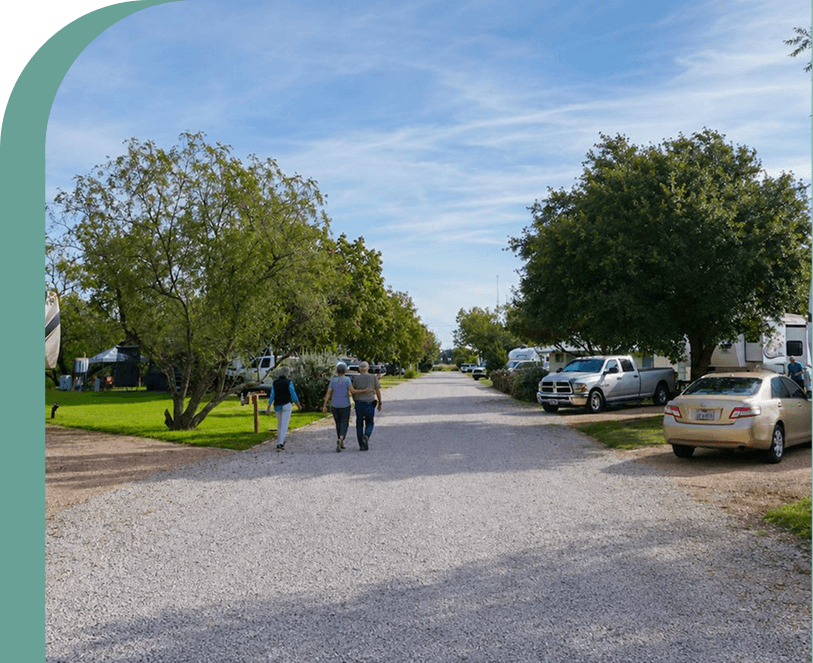 Peaceful RV park road with trees and spacious sites near San Antonio, Texas