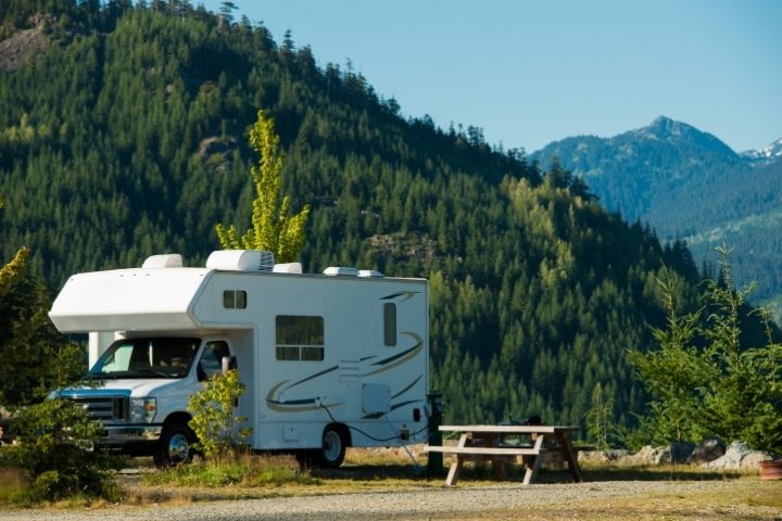 RV parked at a designated campsite representing full-time living at a legal site