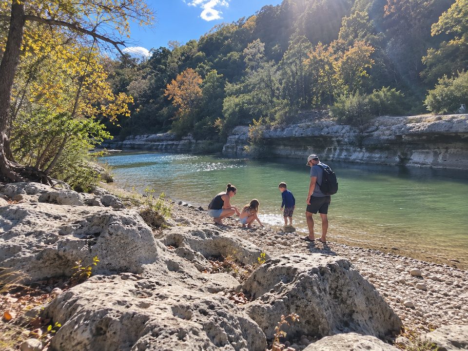 barton creek family riverside outing Family enjoying the rocky shoreline at Barton Creek Greenbelt